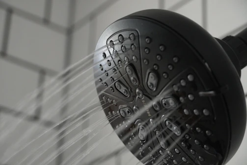 Sports center showers with precision water control devices
