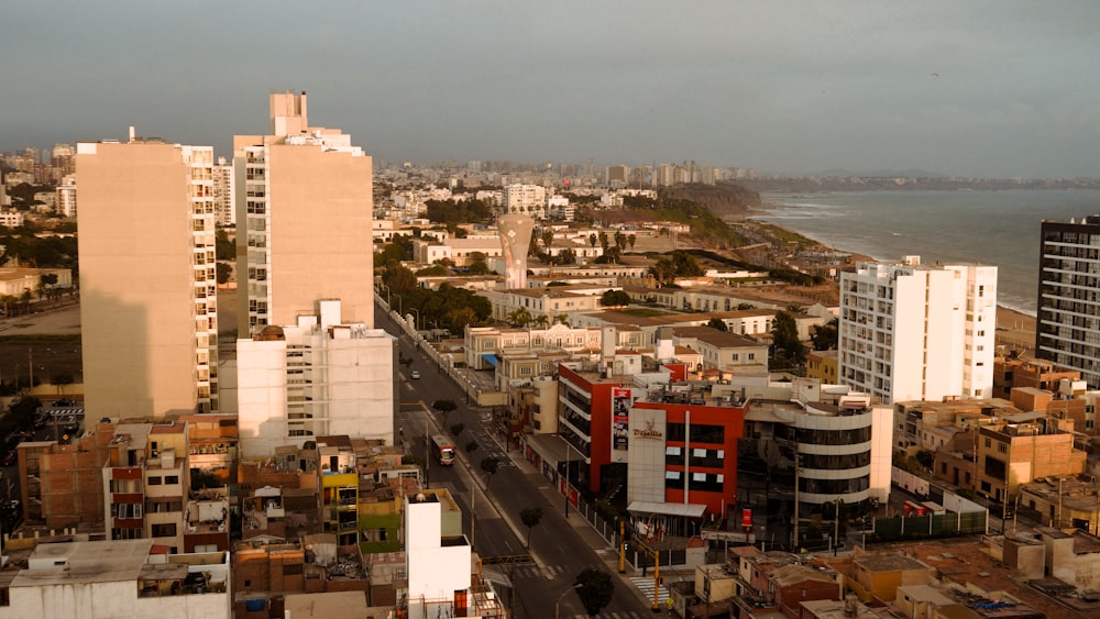 a view of a city with a body of water in the background