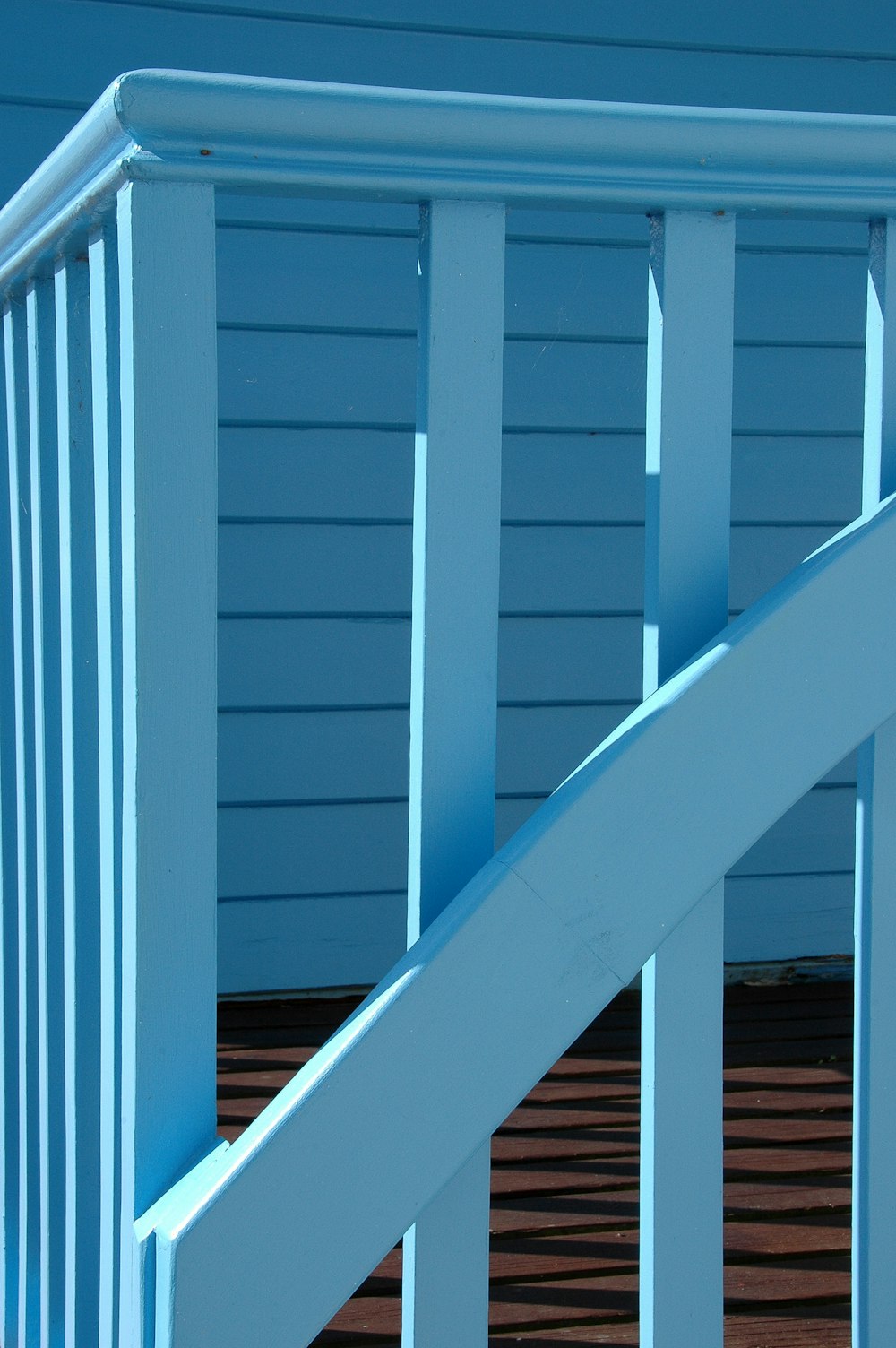 a close up of a white railing on a house