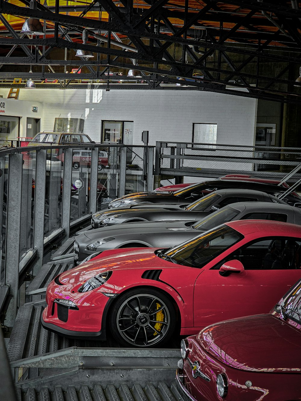 a row of cars parked in a parking garage