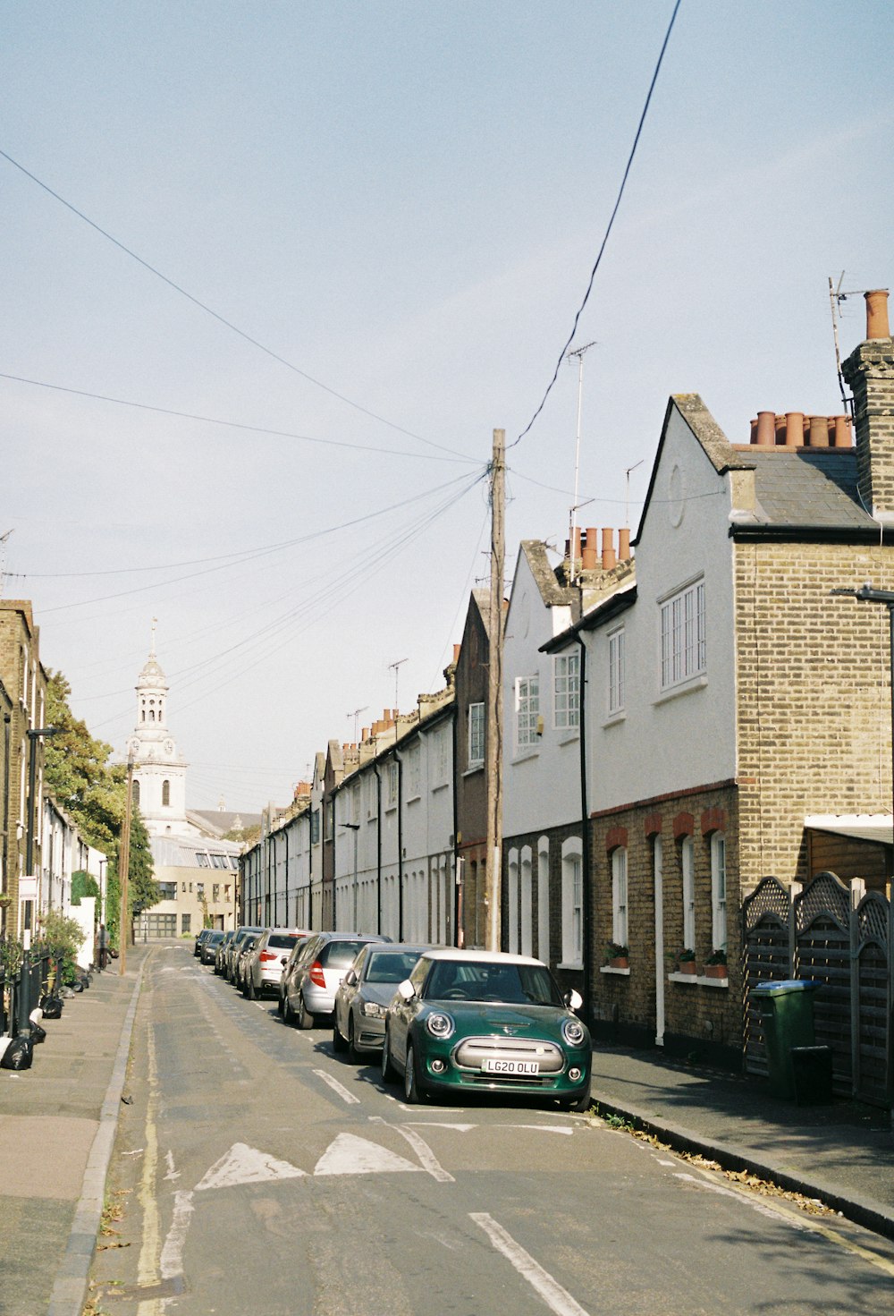 a row of parked cars on a city street