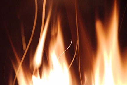 a close up of a fire with flames coming out of it