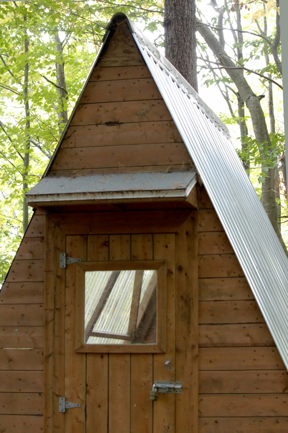 a small wooden cabin in the woods