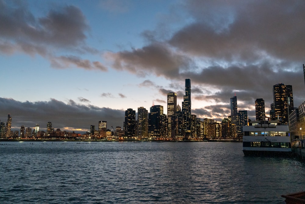 a city skyline with a boat in the foreground