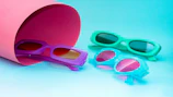 Various colorful eyeglass accessories arranged on a bright table.