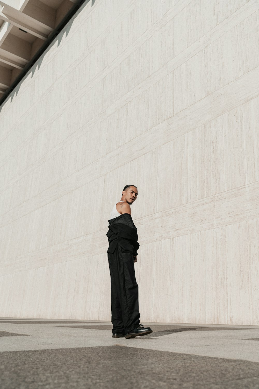 a woman standing in front of a building