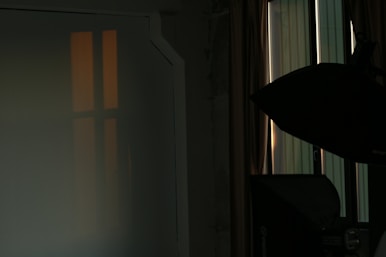 Softbox and ring lights illuminating a cozy studio corner.