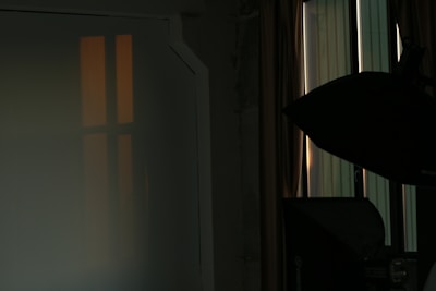A cozy photography studio setup with soft lighting.