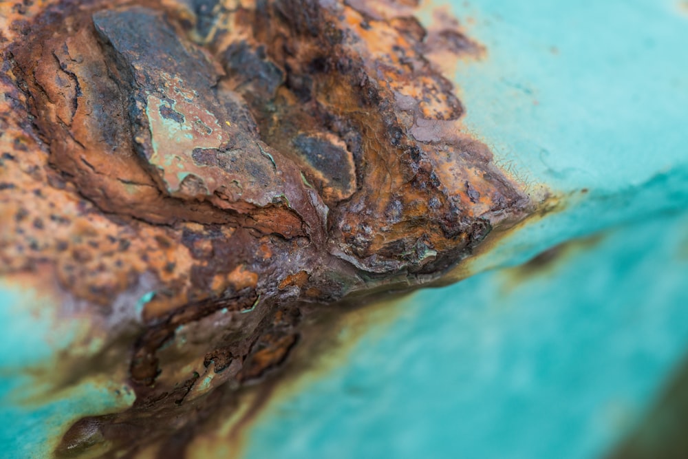 a close up of a rusted metal surface