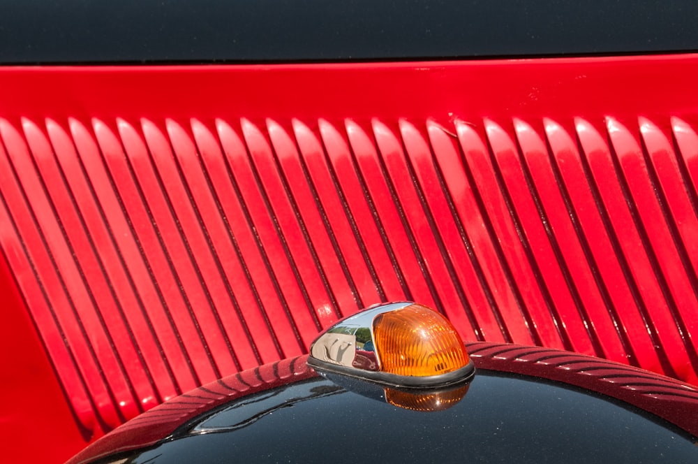 a close up of the tail light of a classic car