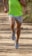 A person jogging on a scenic trail wearing comfortable running shoes.