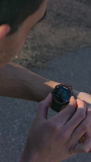 a close up of a person holding a smart watch