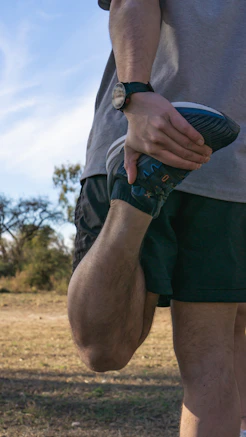 a man holding a frisbee in his right hand