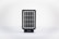 A small, rectangular solar panel device with a grid-like pattern of photovoltaic cells encased in a black frame. It is set against a clean, white background.