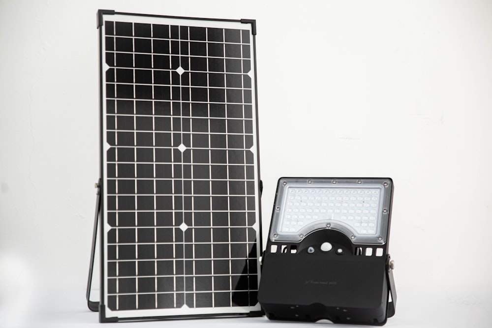 a solar panel and a cd player on a table
