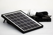 a solar panel with a light bulb on top of it