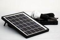 a solar panel with a light bulb on top of it