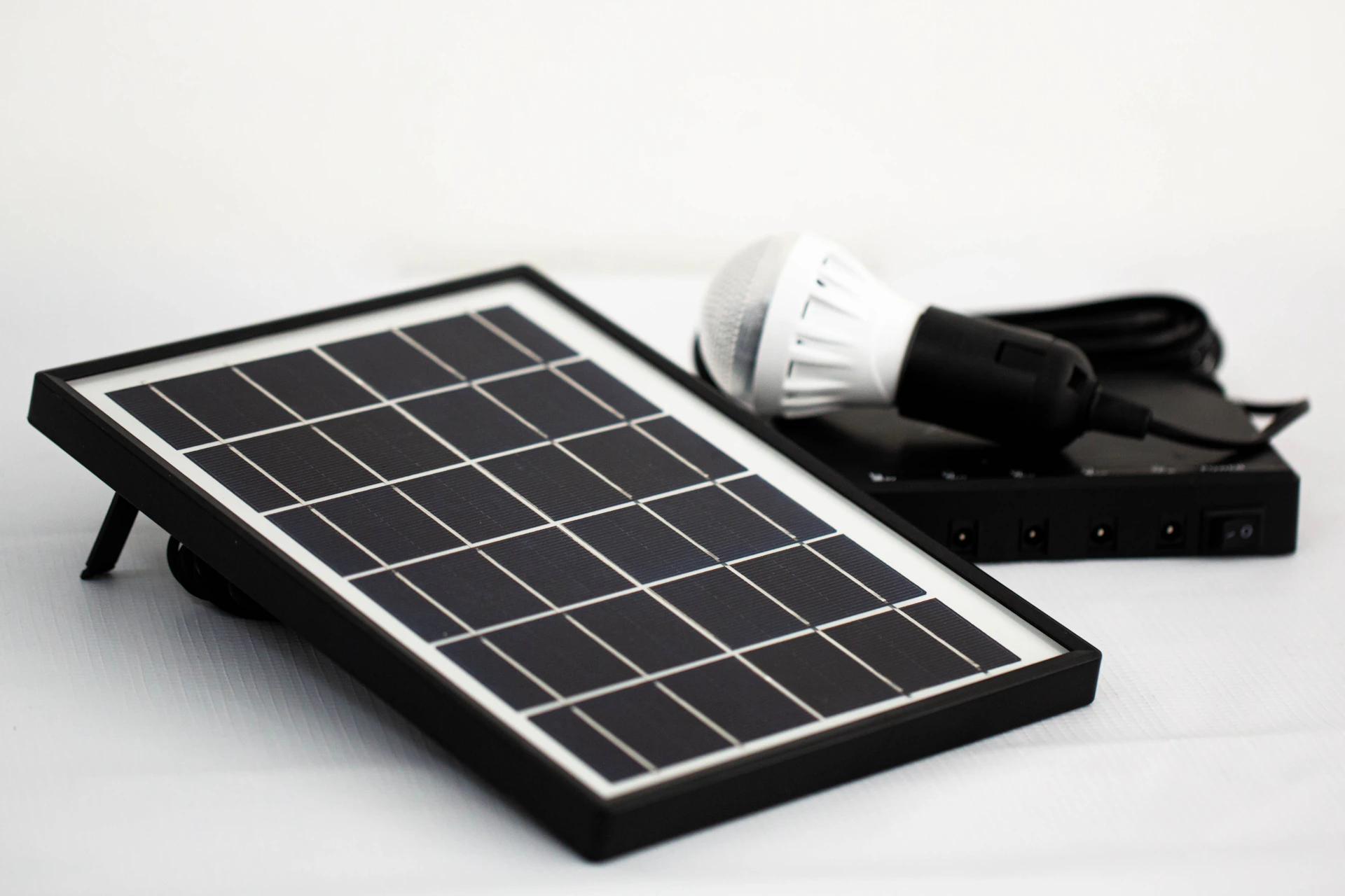 a solar panel with a light bulb on top of it