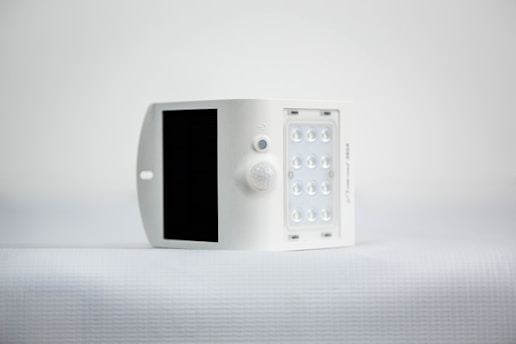 Close-up of orwic's high-efficiency silicon solar cells integrated on a wearable device, glowing softly under natural light.