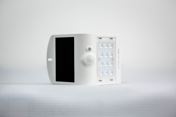 A smiling customer holding a solar-powered device, happy with their purchase.