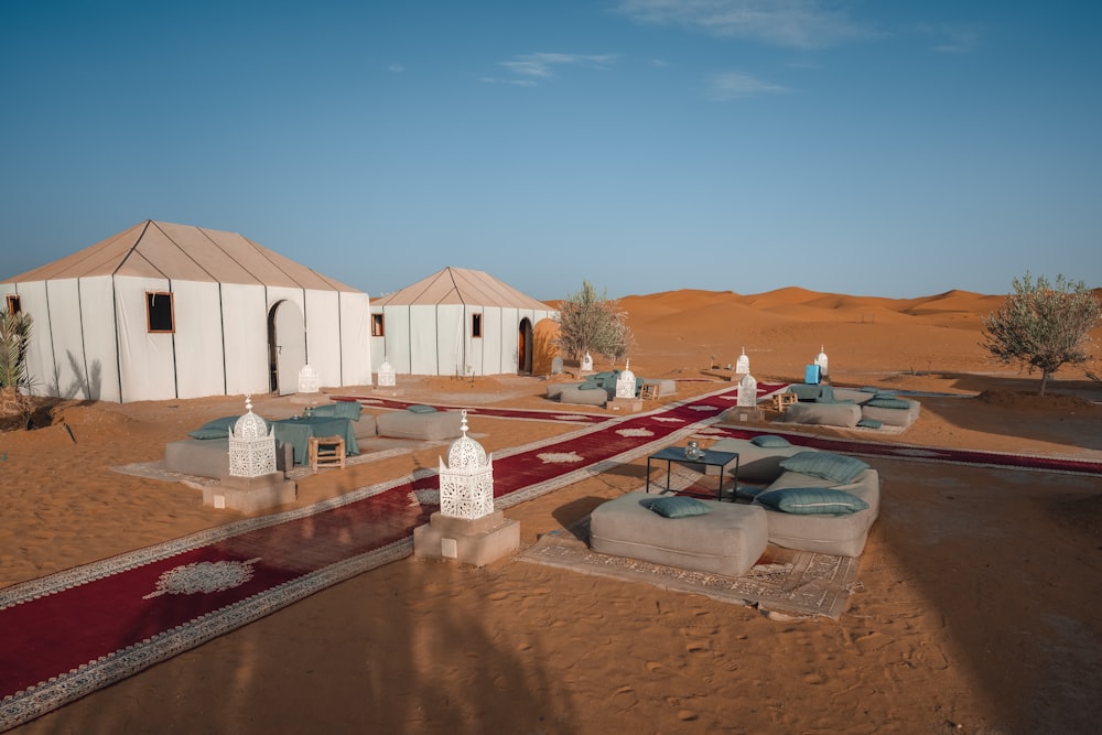 a group of tents in the middle of a desert