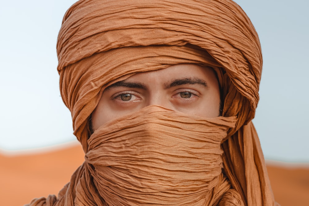a man with a scarf wrapped around his head