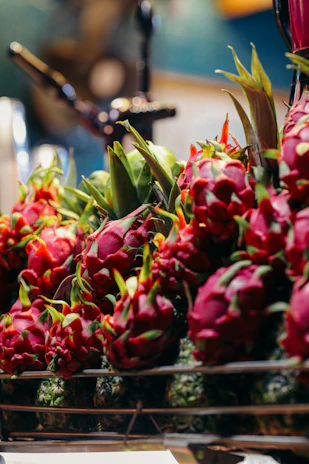 a bunch of dragon fruit sitting on a table