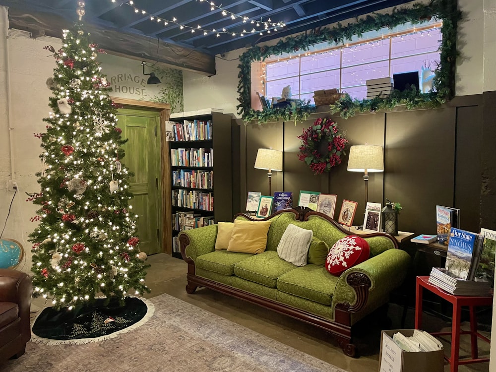 a living room filled with furniture and a christmas tree