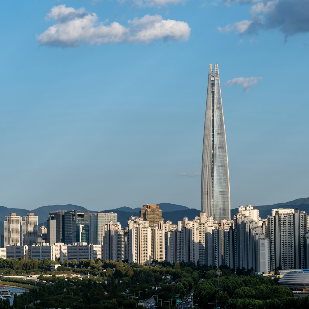 a very tall building towering over a city