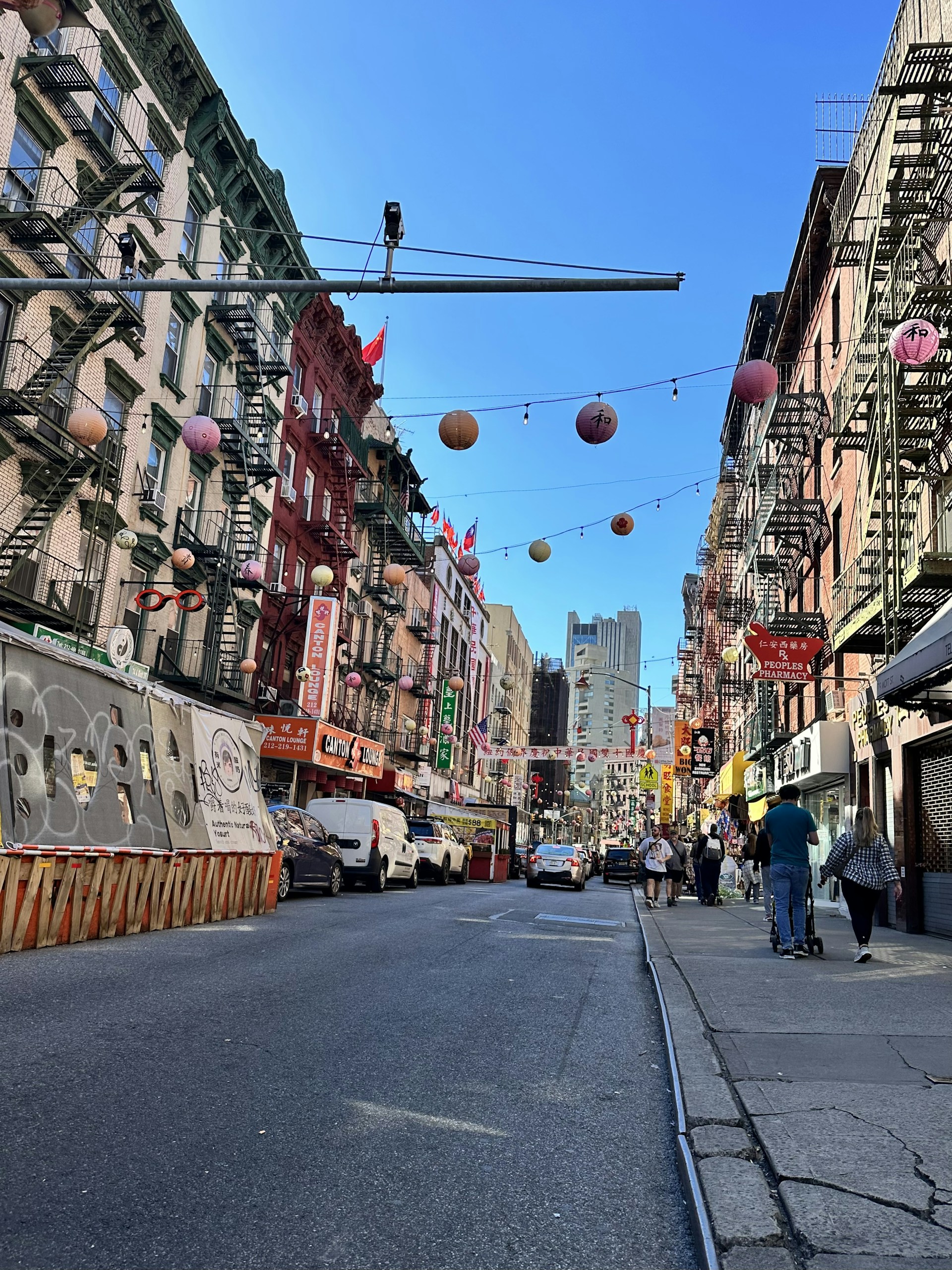 An artistic shot of a vibrant city street, filled with life and colorful storefronts.