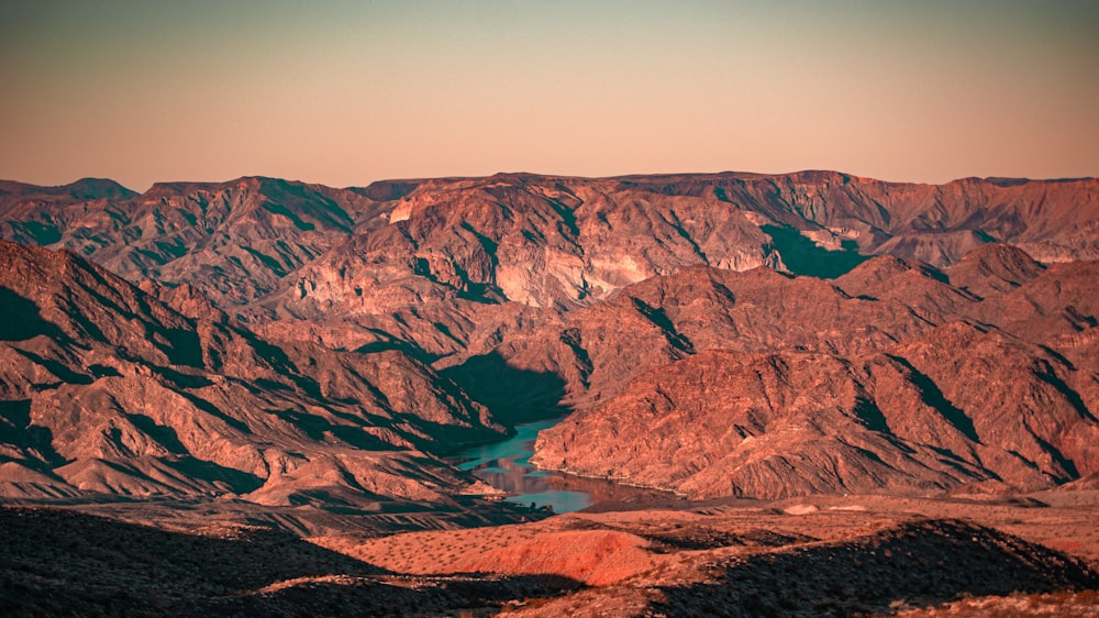 a mountain range with a lake in the middle