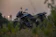 a motorcycle is parked in a grassy field