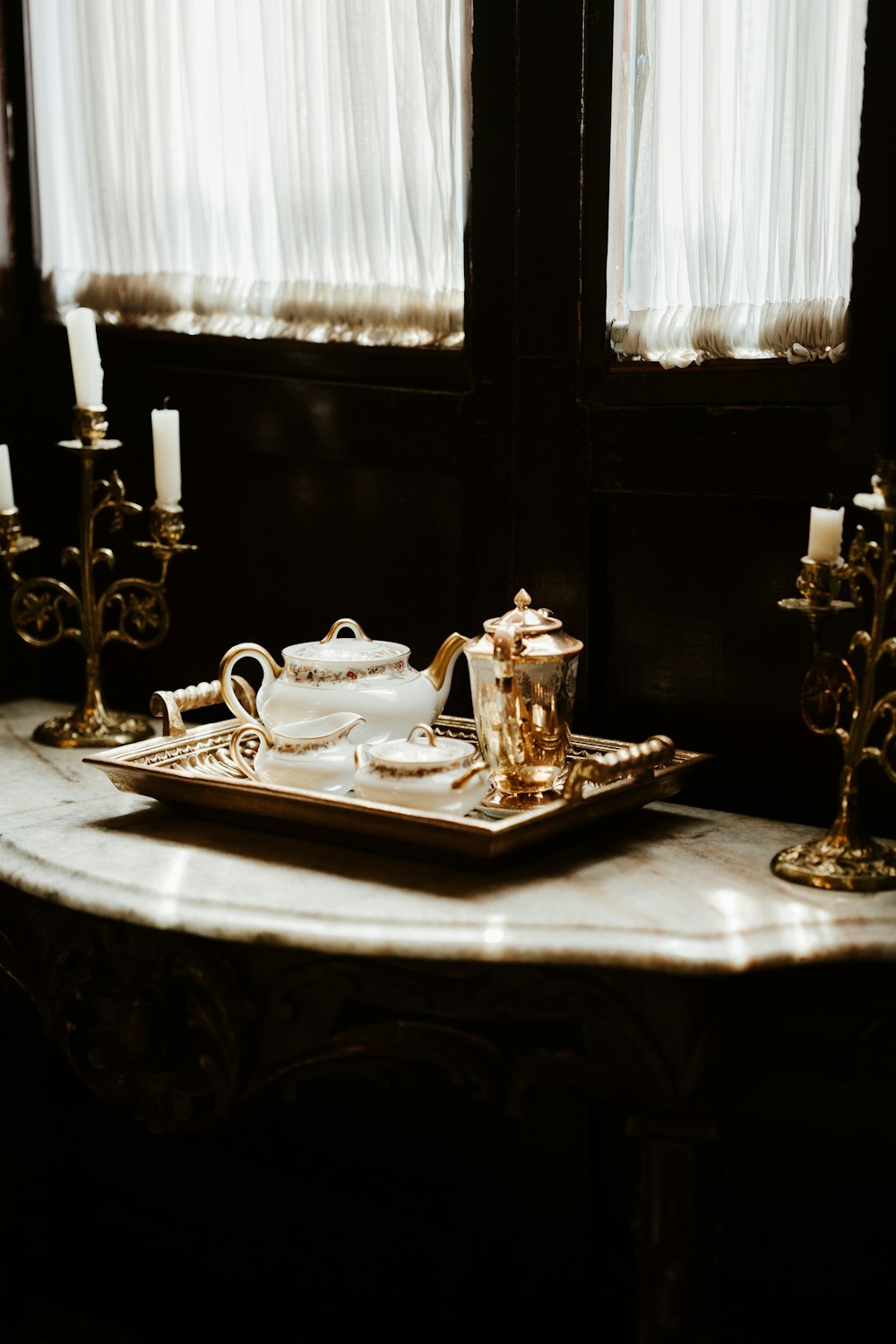 a tray with a tea set on top of it