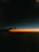 A vibrant photo of a sunrise over an airplane wing, evoking the thrill of travel.