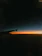 A vibrant photo of a sunrise over an airplane wing, evoking the thrill of travel.