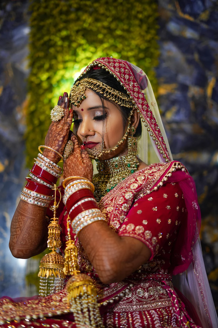Bride wearing gold kalire hanging from her bridal chooda bangles