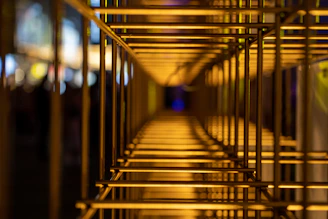 Abstract view of metal gym bars with soft natural light creating a calm atmosphere