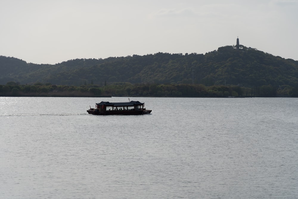 a small boat traveling across a large body of water