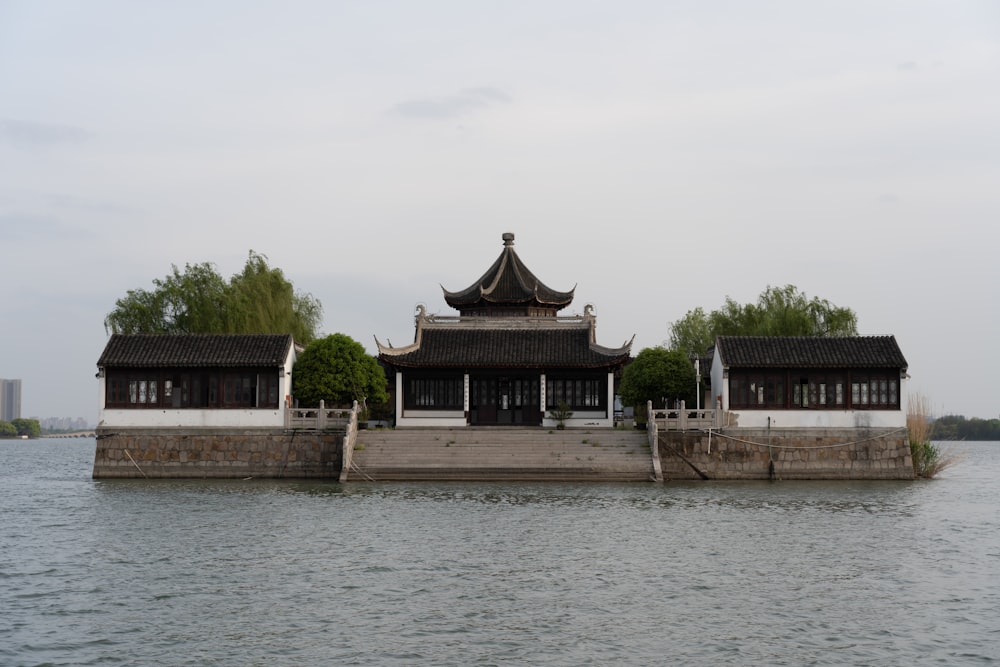 a building sitting on top of a body of water