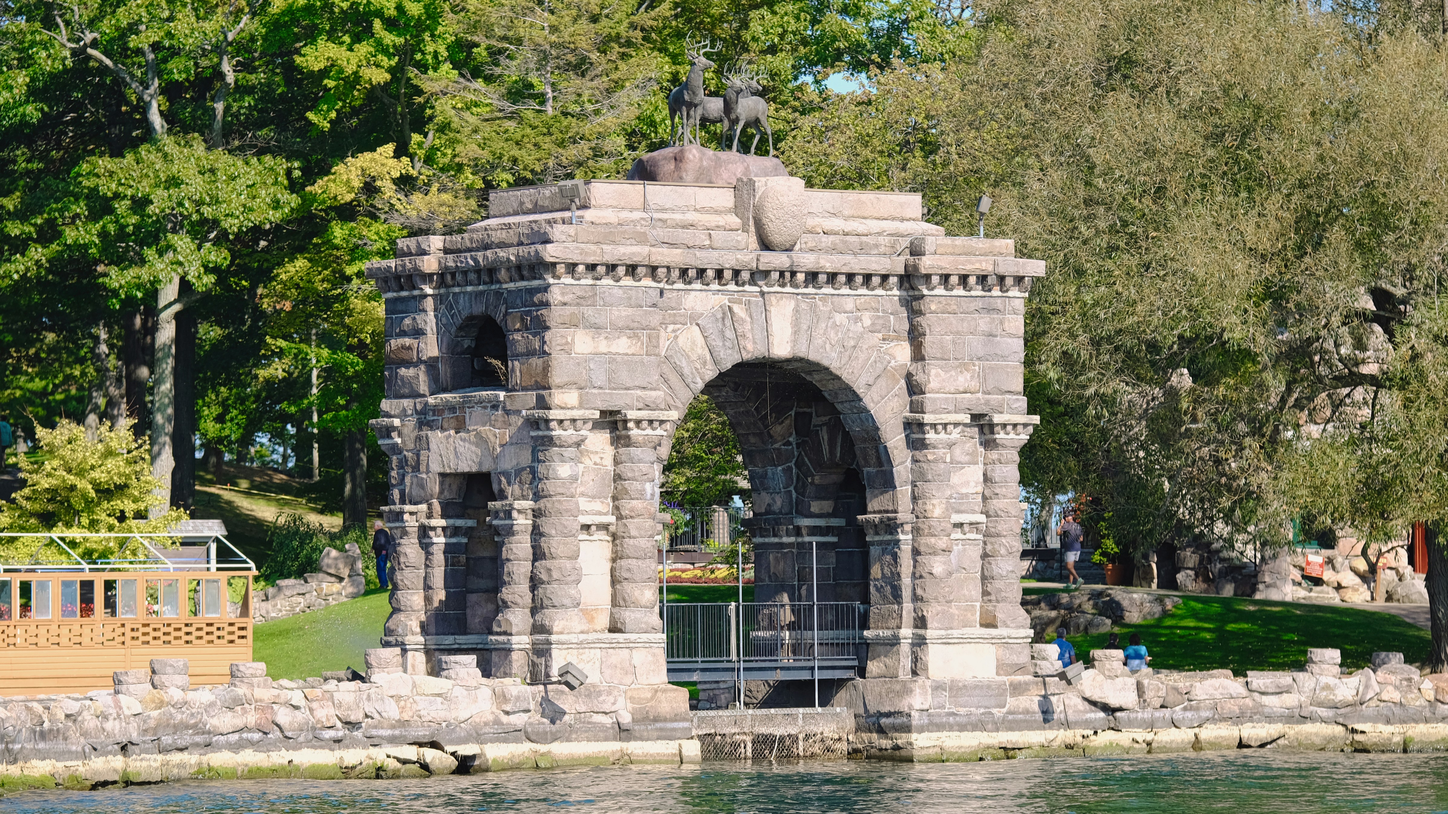 a statue of a man on a horse near a body of water
