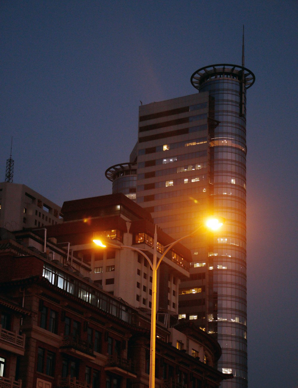 a street light in front of a tall building