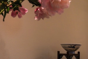 Close-up of a delicate ceramic floral arrangement with soft pastel colors