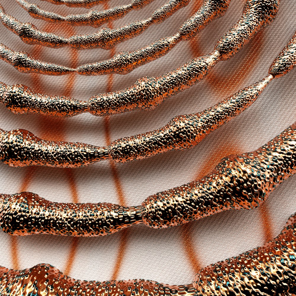 a close up of a metal object on a white surface