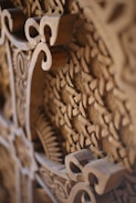 a close up of a wooden carving of a clock