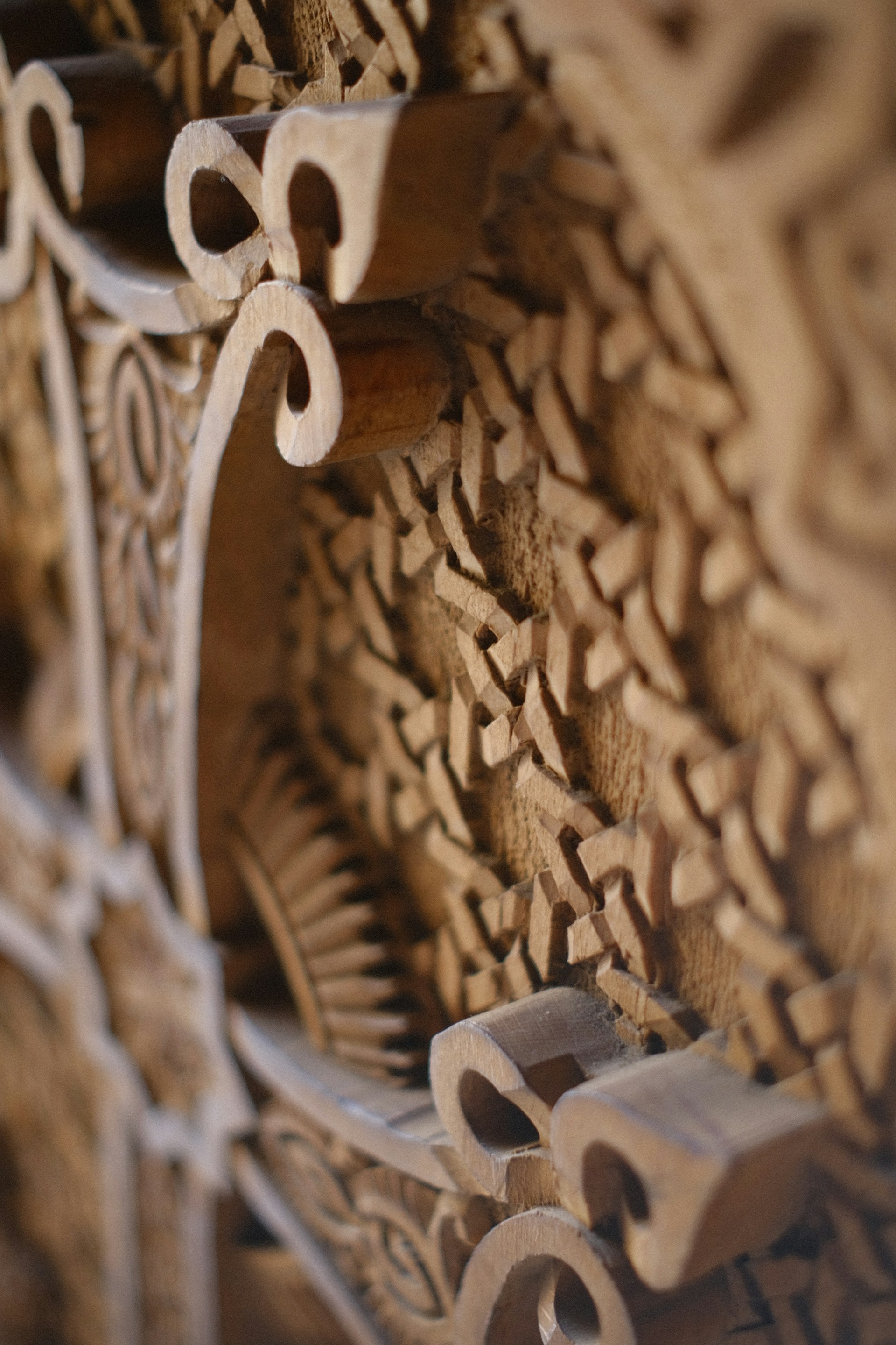 a close up of a wooden carving of a clock