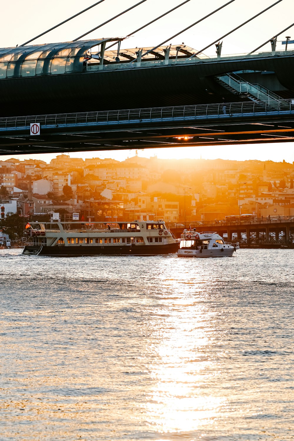 a bridge over a body of water with boats on it