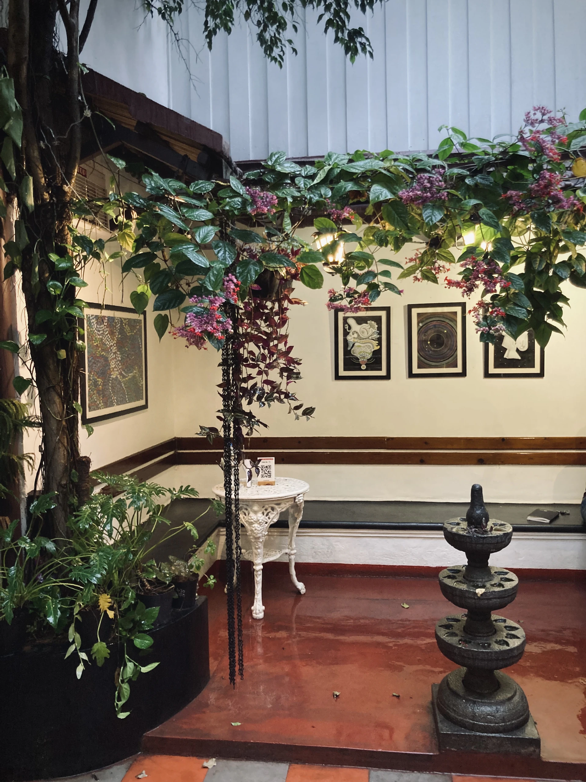 Cozy corner of the wellness space featuring natural textures, a small water fountain, and soothing earth-toned decor that invites relaxation.