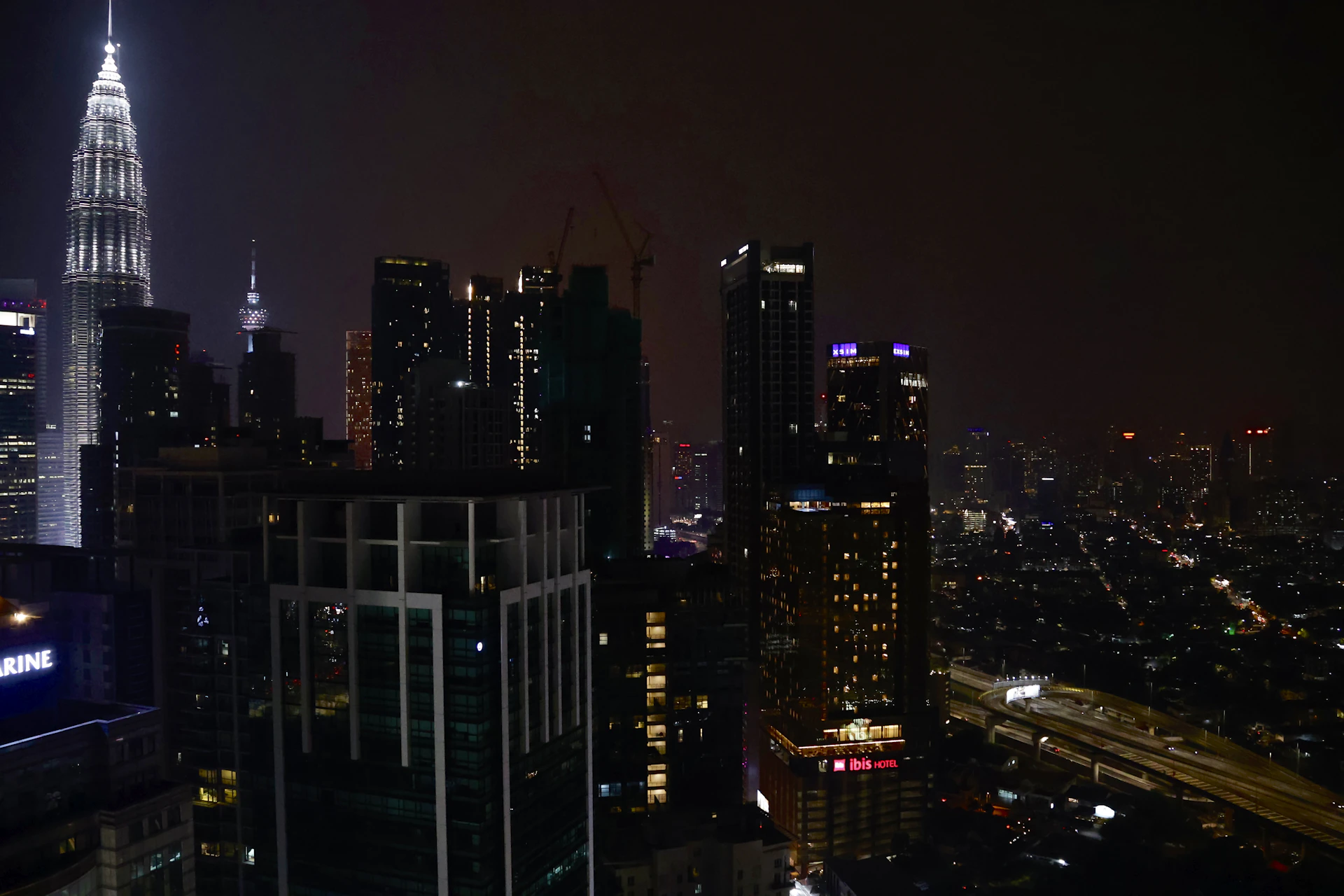 a view of a city at night from the top of a building