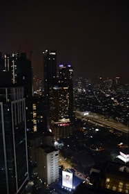 A glowing financial graph overlay on a dark cityscape representing growth and opportunity.