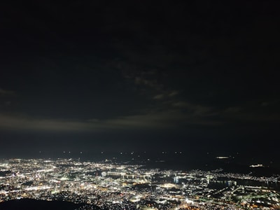 A detailed city map with glowing lines representing data flow between telecommunications towers.